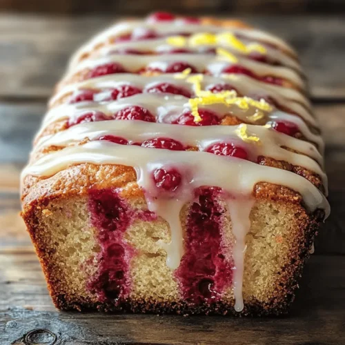 If you’re looking for a delightful treat that combines the refreshing flavors of summer with the comforting nature of baked goods, look no further than the Raspberry Lemon Loaf. This luscious loaf cake is a perfect balance of sweet and tart, featuring juicy fresh raspberries enveloped in a tender, zesty lemon batter. The addition of a tangy icing on top elevates this loaf, making it a delightful centerpiece for any gathering or a sweet indulgence for your afternoon tea.