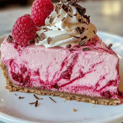 Cheesecake is a timeless dessert that has captured the hearts and palates of dessert lovers around the globe. Its creamy texture and versatility allow for endless flavor combinations, making it a go-to choice for celebrations and special occasions. In recent years, creative flavors and vibrant colors have taken center stage in the dessert world, pushing the boundaries of traditional recipes. Enter the Luxurious Pink Velvet Raspberry Cheesecake — a stunning dessert that not only appeals to the taste buds but also delights the eyes. This recipe features a rich, velvety pink cheesecake infused with fresh raspberries, creating a harmonious balance of sweetness and tartness that is simply irresistible.